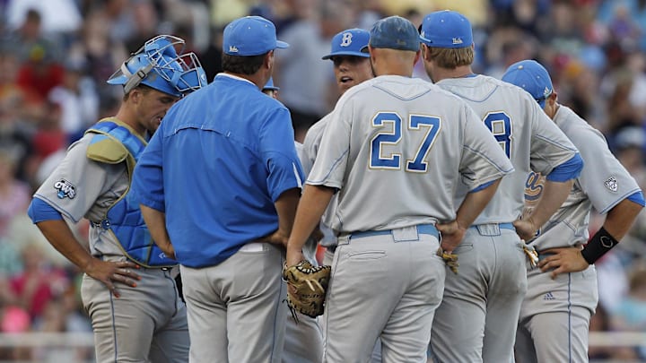 Jun 18, 2013; Omaha, NE, USA; UCLA Bruins head coach John Savage (22) talks to his team during the game against the North Carolina State Wolfpack during the College World Series at TD Ameritrade Park. Mandatory Credit: Bruce Thorson-Imagn Images Jun 18, 2013; Omaha, NE, USA; UCLA Bruins head coach John Savage (22) talks to his team during the game against the North Carolina State Wolfpack during the College World Series at TD Ameritrade Park. Mandatory Credit: Bruce Thorson-Imagn Images