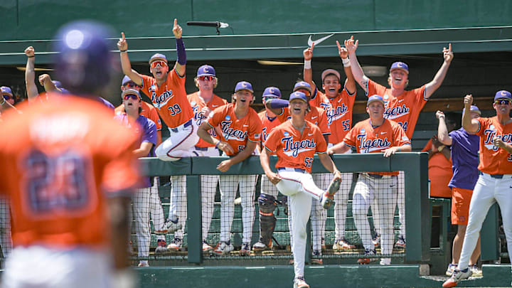 Clemson players react as Clemson freshman Jarren Purify (23) hit a triple against University of Florida during the bottom of the second inning of the NCAA baseball Clemson Super Regional at Doug Kingsmore Stadium in Clemson Saturday, June 8, 2024. Clemson players react as Clemson freshman Jarren Purify (23) hit a triple against University of Florida during the bottom of the second inning of the NCAA baseball Clemson Super Regional at Doug Kingsmore Stadium in Clemson Saturday, June 8, 2024.