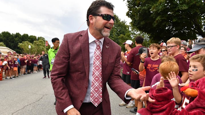 Sep 6, 2025; Blacksburg, Virginia, USA;  Virginia Tech Hokies head coach Brent Pry greets fans as he enters the stadium prior to the game at Lane Stadium. Mandatory Credit: Brian Bishop-Imagn Images