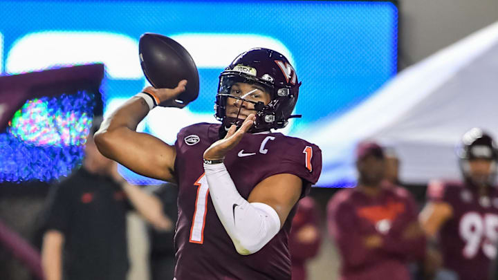 Sep 13, 2025; Blacksburg, Virginia, USA;  Virginia Tech Hokies quarterback Kyron Drones (1) throws a pass during the second quarter at Lane Stadium. Mandatory Credit: Brian Bishop-Imagn Images