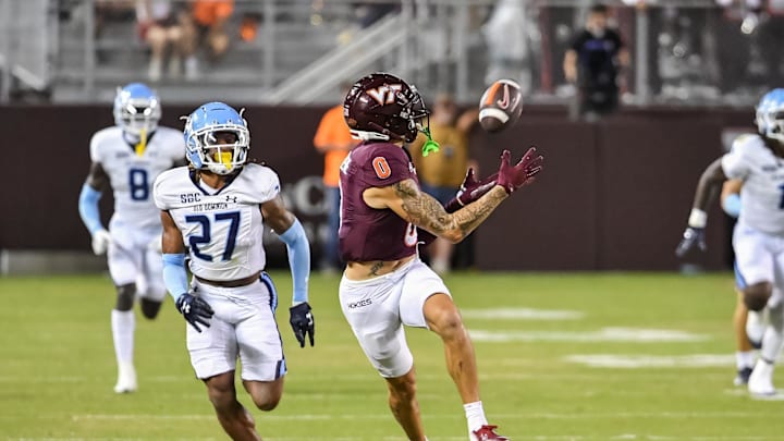 Sep 13, 2025; Blacksburg, Va.; Virginia Tech wide receiver Ayden Greene (0) catches a pass in front of Old Dominion safety Jordan Saunders (27).