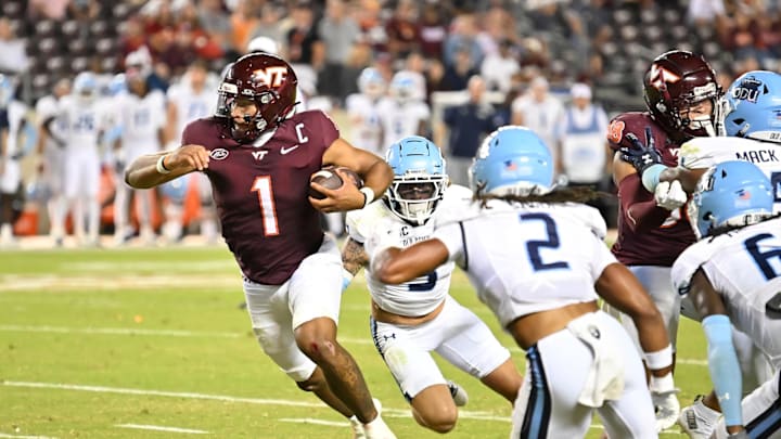 Sep 13, 2025; Blacksburg, Virginia, USA;  Virginia Tech Hokies quarterback Kyron Drones (1) runs the ball during the fourth quarter at Lane Stadium. Mandatory Credit: Brian Bishop-Imagn Images