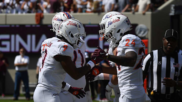 Sep 20, 2025; Blacksburg, Va.; Virginia Tech wide receiver Cameron Seldon (9) celebrates with running back Braydon Bennett (24) after a touchdown.