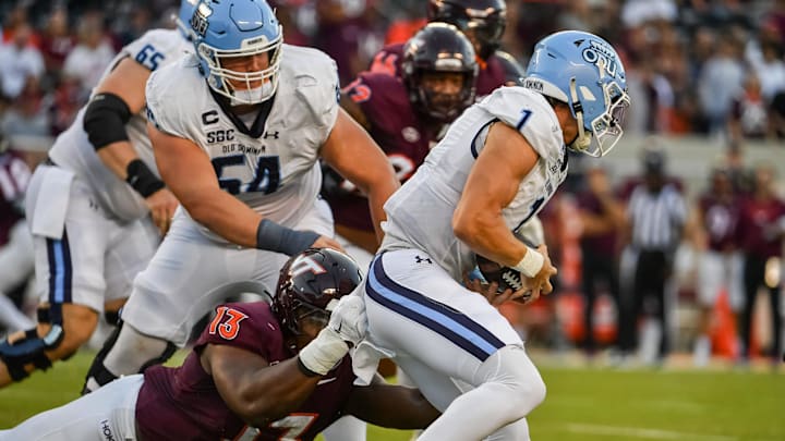 Sep 13, 2025; Blacksburg, Va.; Virginia Tech defensive lineman Kemari Copeland (13) tackles Old Dominion quarterback Colton Joseph (1).