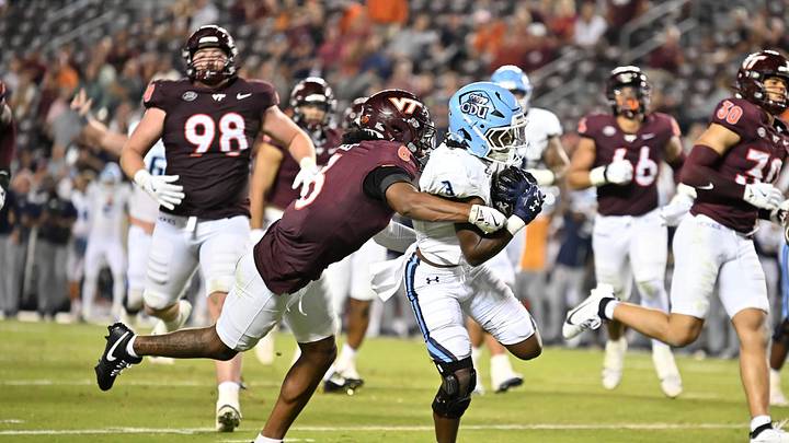 Sep 13, 2025; Blacksburg, Va.; Virginia Tech safety Jordan Bass (6) attempts to tackle ODU running back Devin Roche (3) as he runs the ball for a touchdown.