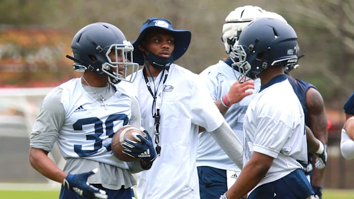 Georgia Southern running back coach Favian Upshaw works with players during a drill. Upshaw was a quarterback for the Eagles and MVP of the 2015 GoDaddy Bowl.