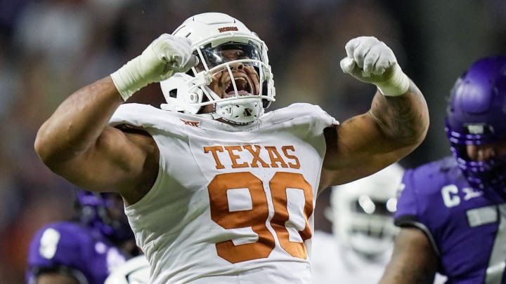 Texas Longhorns defensive lineman Byron Murphy II (90) celebrates after a sack against TCU Horned Frogs quarterback Josh Hoover (10) in the second quarter of an NCAA college football game, Saturday, November. 11, 2023, at Amon G. Carter Stadium in Fort Worth, Texas. Texas Longhorns defensive lineman Byron Murphy II (90) celebrates after a sack against TCU Horned Frogs quarterback Josh Hoover (10) in the second quarter of an NCAA college football game, Saturday, November. 11, 2023, at Amon G. Carter Stadium in Fort Worth, Texas.