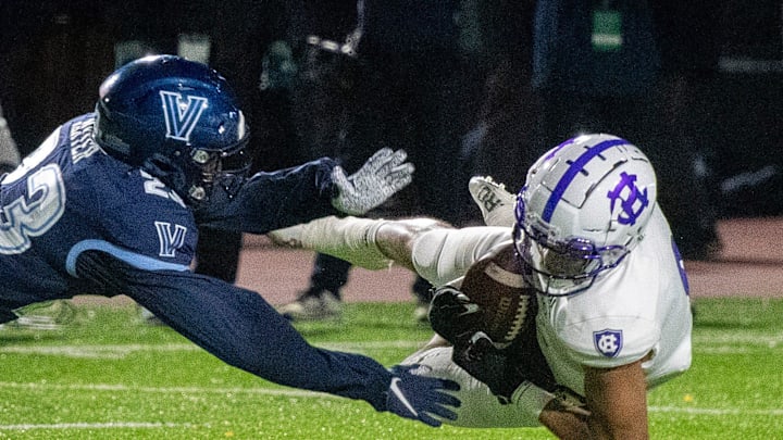 Holy Cross wide receiver Tenio Ayeni makes a diving catch in front of Villanova's Isas Waxter