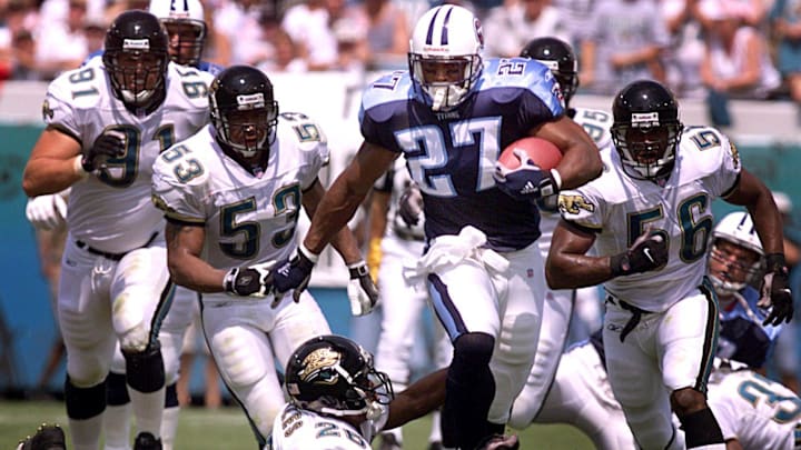 Running back Eddie George (27), in action against Jacksonville Jaguars in Jacksonville, Fla., on Sept. 23, was the Tennessee Titans' leading rusher for 2001 with 939 yards on 315 carries with 5 rushing touchdowns.