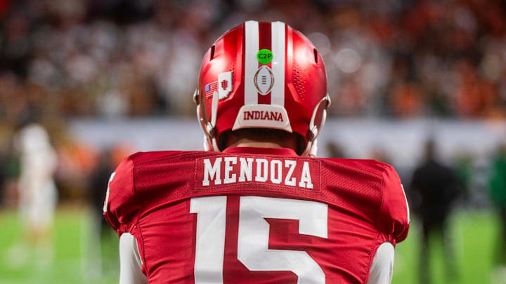 Indiana's Fernando Mendoza (15) gets loose before the College Football Playoff National Championship college football game at Hard Rock Stadium in Miami Gardens on Monday, Jan. 19, 2026.