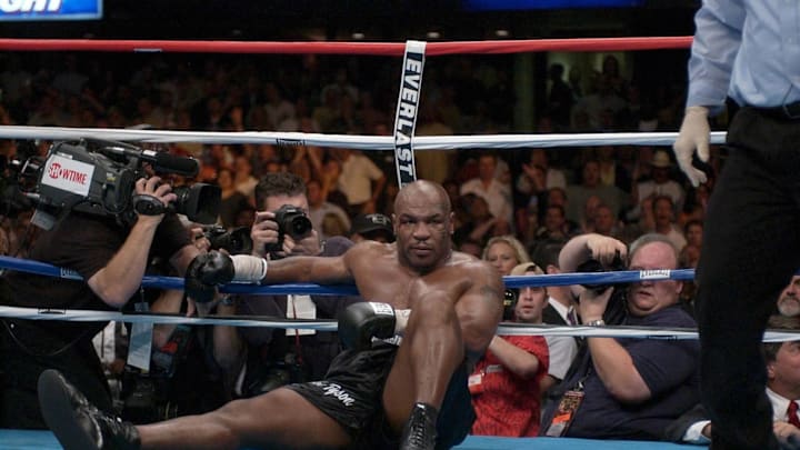 Former champ Mike Tyson lay sprawled in the ropes last night in the fourth round of his fight with British heavyweight Danny Williams before more than 17,000 fans at Freedom Hall. Tyson untangled himself but could not get up before the referee's count ended. Former champ Mike Tyson lay sprawled in the ropes last night in the fourth round of his fight with British heavyweight Danny Williams before more than 17,000 fans at Freedom Hall. Tyson untangled himself but could not get up before the referee's count ended.