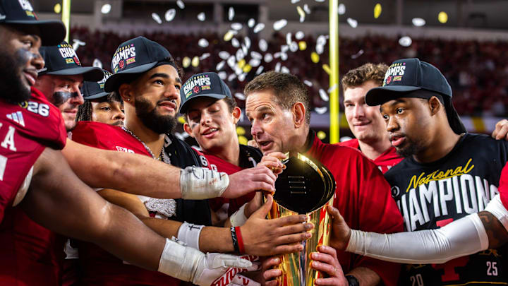 Indiana Head Coach Curt Cignetti talks with his team as they grab the trophy after the College Football Playoff National Championship. Indiana Head Coach Curt Cignetti talks with his team as they grab the trophy after the College Football Playoff National Championship.