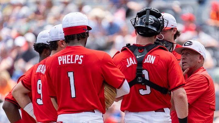 Georgia Bulldogs head coach Wes Johnson huddles with his team as Georgia Bulldogs take on Florida Gators during the SEC baseball tournament at Hoover Metropolitan Stadium in Hoover, Ala. on Saturday, May 23, 2026.