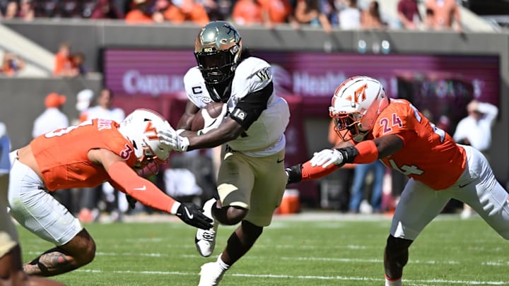 Oct 4, 2025; Blacksburg, Virginia, USA; Virginia Tech Hokies linebacker Kaleb Spencer (3) and linebacker Jaden Keller (24) prepare to tackle Wake Forest Demon Deacons running back Demond Claiborne (1) during the first quarter at Lane Stadium. Mandatory Credit: Brian Bishop-Imagn Images Oct 4, 2025; Blacksburg, Virginia, USA; Virginia Tech Hokies linebacker Kaleb Spencer (3) and linebacker Jaden Keller (24) prepare to tackle Wake Forest Demon Deacons running back Demond Claiborne (1) during the first quarter at Lane Stadium. Mandatory Credit: Brian Bishop-Imagn Images