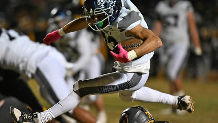 Damonte’s Kobe Craig hurdles over Galena’s Zak Smrt during Friday’s 5A-North Division 3 Championship game at Galena High School on Friday Nov. 15, 2024. Galena won 16-13.