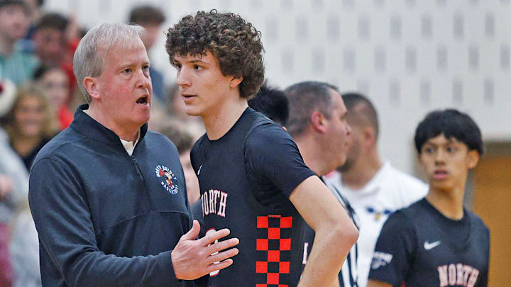 Raiders coach Kevin Barrett talks with player Lucas Short between quarters.
The Hanover Hawks hosted the North Quincy Raiders in boys basketball on Friday, December 20, 2024