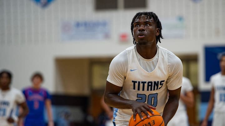 The Ridgeland Titans' point guard Phil Nelson (20) gears up to shoot a free throw during the game against the Neshoba Central Rockets in Ridgeland, Miss., on Thursday, Jan. 23, 2025.