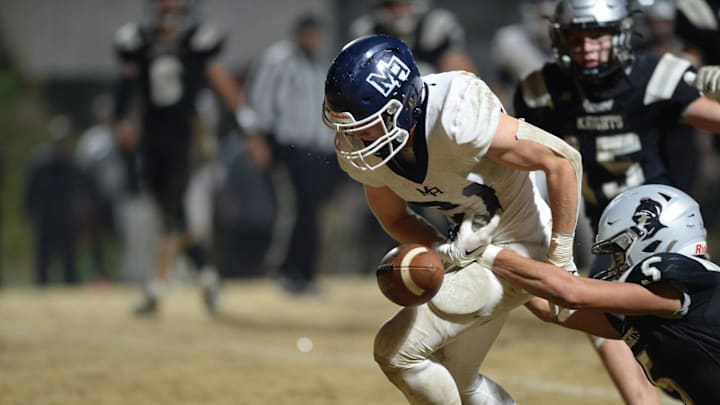Mount Airy's Walker Stroup is caught by Robbinsville's Darion Ledbetter, December 1, 2023. Mount Airy's Walker Stroup is caught by Robbinsville's Darion Ledbetter, December 1, 2023.