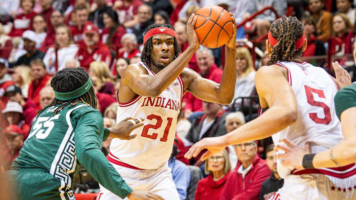 Indiana's Mackenzie Mgbako (21) passes inside to Malik Reneau (5) during the first half of the Indiana versus Michigan State men's basketball game at Simon Skjodt Assembly Hall on Sunday, March 10, 2024.