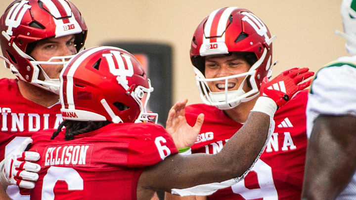 Indiana's Justice Ellison (6) and Kurtis Rourke (9) celebrate a touchdown against Charlotte.