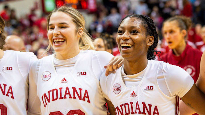 Indiana's Chloe Moore-McNeil (22) shares a laugh with Julianna LaMendola (20) after the second half of the Indiana versus Illinois women's basketball game at Simon Skjodt Assembly Hall on Sunday, Dec. 31, 2023.
