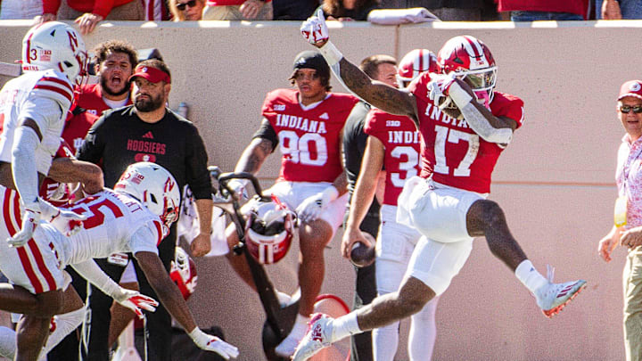 Indiana's Ty Son Lawton (17) leaps as he runs during the Indiana versus Nebraska football game at Memorial Stadium on Saturday, Oct. 19, 2024.
