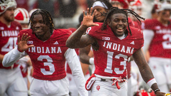 Indiana's Cedarius Doss (13) and JoJo Johnson (3) celebrate being 5-0 after the Indiana versus Maryland football game at Memorial Stadium on Saturday, Sept. 28, 2024.