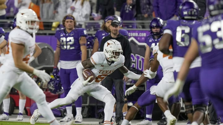 Texas Longhorns defensive back Terrance Brooks (8) tries to run the ball back after a interception against TCU Horned Frogs quarterback Josh Hoover (10) in the second quarter of an NCAA college football game, Saturday, November. 11, 2023, at Amon G. Carter Stadium in Fort Worth, Texas. Texas Longhorns defensive back Terrance Brooks (8) tries to run the ball back after a interception against TCU Horned Frogs quarterback Josh Hoover (10) in the second quarter of an NCAA college football game, Saturday, November. 11, 2023, at Amon G. Carter Stadium in Fort Worth, Texas.