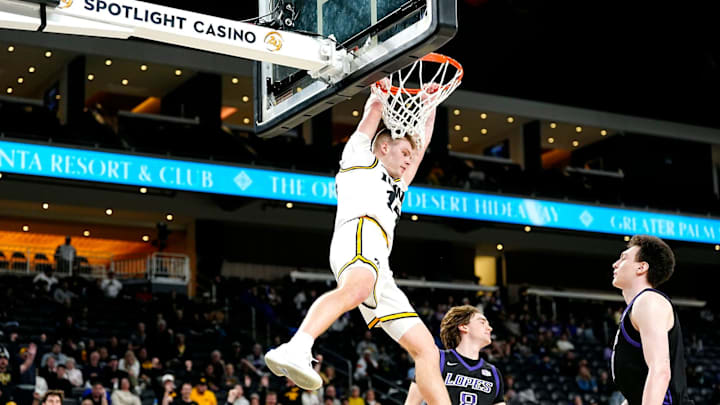 Iowa guard Bennett Stirtz (14) dunks against Grand Canyon during their Acrisure Series championship basketball game at Acrisure Arena in Palm Desert, Calif., on Nov. 26, 2025.