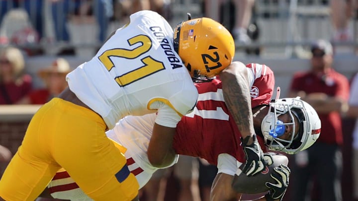 Oklahoma wide receiver JaVonnie Gibson (11) makes a catch as he is tackled by Kent State defensive back Joel Cordoba (21) during the first half of an NCAA football game between the Oklahoma Sooners (OU) and Kent State Golden Flashes at Gaylord Family - Oklahoma Memorial Stadium in Norman, Okla., Saturday, Oct. 4, 2025.