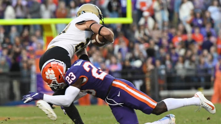 Clemson defensive back Andrew Booth, Jr.(23) tackles Wofford receiver Landon Parker in 2019.