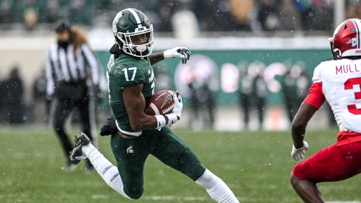 Michigan State's Tre Mosley runs after a catch against Indiana during double overtime on Saturday,