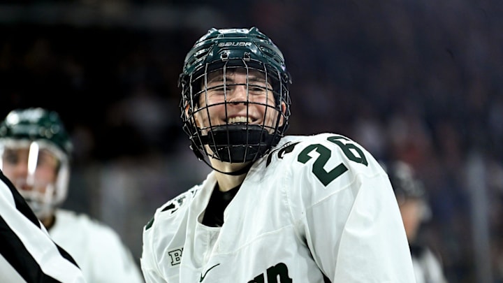 Michigan State's Tanner Kelly smiles after getting shoved by a Michigan player during the second period on Friday, Dec. 9, 2022, at Munn Arena in East Lansing.

221209 Msu Mich Hockey 100a