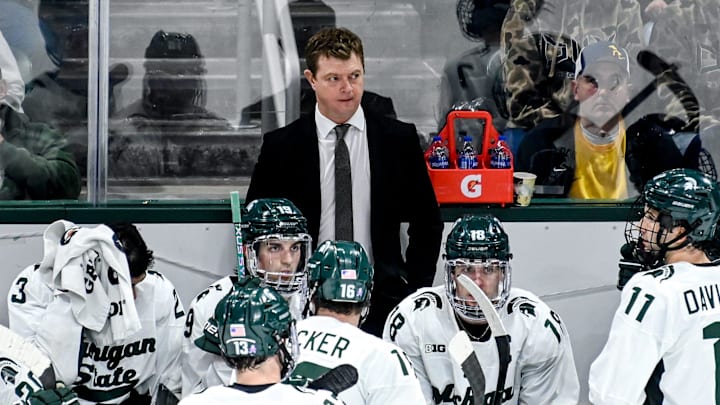 Michigan State's head coach Adam Nightingale, center, looks on during the third period in the game against Michigan on Friday, Dec. 9, 2022, at Munn Arena in East Lansing.

221209 Msu Mich Hockey 125a