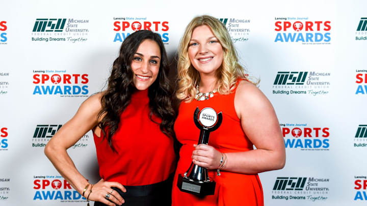 Girls Water Polo Player of the Year Grand Ledge's Isabel Lee, right, poses with guest speaker Olympic gold medalist Jordyn Wieber during the Lansing State Journal Sports Awards on Tuesday, June 4, 2019, at the Wharton Center in East Lansing.