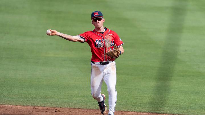 Ole Miss Rebels' Dom Decker (12) throws the ball to first base as Auburn Tigers take on Ole Miss Rebels during the NCAA Super Regional game two at Plainsman Park in Auburn, Ala. on Saturday, June 6, 2026. Ole Miss Rebels' Dom Decker (12) throws the ball to first base as Auburn Tigers take on Ole Miss Rebels during the NCAA Super Regional game two at Plainsman Park in Auburn, Ala. on Saturday, June 6, 2026.