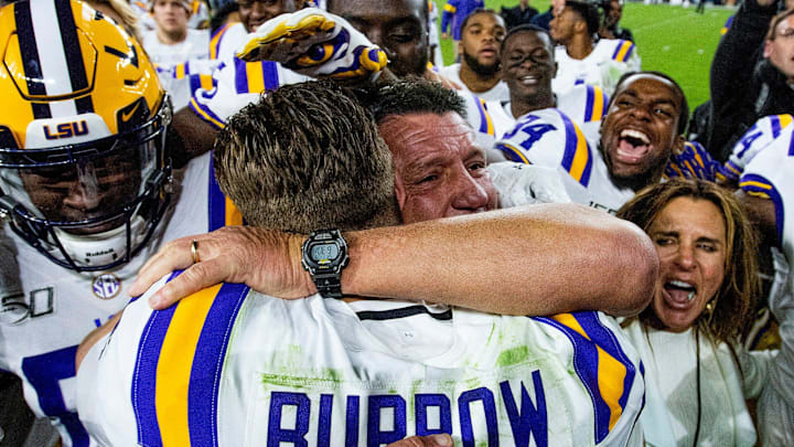 LSU head coach Ed Orgeron hugs quarterback Joe Burrow (9) after defeating Alabama at Bryant-Denny Stadium in Tuscaloosa, Ala., on Saturday November 9, 2019 LSU head coach Ed Orgeron hugs quarterback Joe Burrow (9) after defeating Alabama at Bryant-Denny Stadium in Tuscaloosa, Ala., on Saturday November 9, 2019