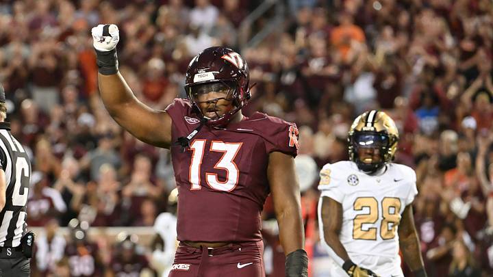 Sep 6, 2025; Blacksburg, Virginia, USA; Virginia Tech Hokies defensive lineman Kemari Copeland (13) celebrates a defensive stop during the first quarter at Lane Stadium. Mandatory Credit: Brian Bishop-Imagn Images Sep 6, 2025; Blacksburg, Virginia, USA; Virginia Tech Hokies defensive lineman Kemari Copeland (13) celebrates a defensive stop during the first quarter at Lane Stadium. Mandatory Credit: Brian Bishop-Imagn Images