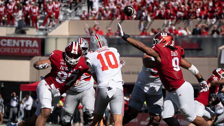 Indiana's Mario Landino (97) and Stephen Daley (9) pressure Ohio State's Julian Sayin (10) during the Indiana versus Ohio State football game at Memorial Stadium on Saturday, Oct. 17, 2026.