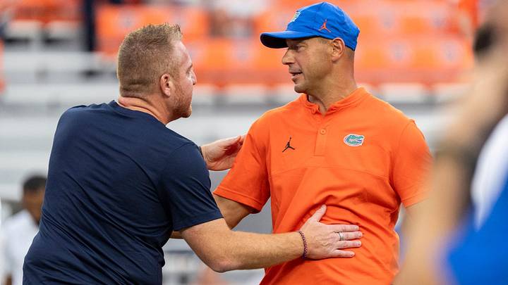 Auburn Tigers head coach Alex Golesh and Florida Gators head coach Jon Sumrall talk during warm ups before Auburn Tigers take on Florida Gators at Jordan-Hare Stadium in Auburn, Ala. on Saturday, Sept. 19, 2026.