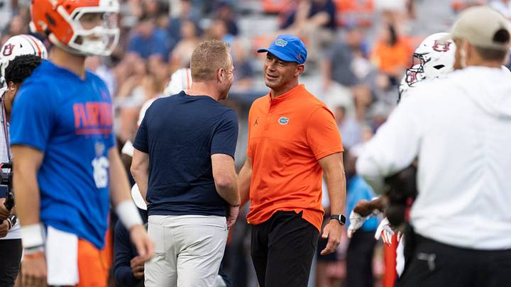 Auburn Tigers head coach Alex Golesh and Florida Gators head coach Jon Sumrall talk during warm ups before Auburn Tigers take on Florida Gators at Jordan-Hare Stadium in Auburn, Ala. on Saturday, Sept. 19, 2026.