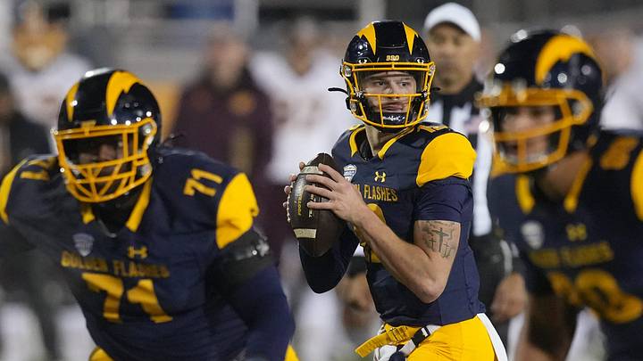Kent State quarterback Dru DeShields (12) look to pass as offensive lineman Matt Pajuste (71) and tight end Terik Mulder (89) give cover during the first half of the game against Central Michigan at Dix Stadium in Kent on November, 19, 2025. Kent State quarterback Dru DeShields (12) look to pass as offensive lineman Matt Pajuste (71) and tight end Terik Mulder (89) give cover during the first half of the game against Central Michigan at Dix Stadium in Kent on November, 19, 2025.
