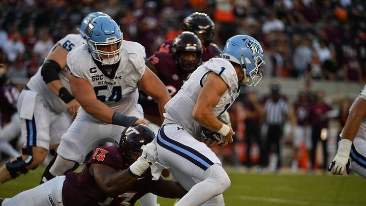 Sep 13, 2025; Blacksburg, Virginia, USA; Virginia Tech Hokies defensive lineman Kemari Copeland (13) tackles Old Dominion Monarchs quarterback Colton Joseph (1) during the first quarter at Lane Stadium. Mandatory Credit: Brian Bishop-Imagn Images Sep 13, 2025; Blacksburg, Virginia, USA; Virginia Tech Hokies defensive lineman Kemari Copeland (13) tackles Old Dominion Monarchs quarterback Colton Joseph (1) during the first quarter at Lane Stadium. Mandatory Credit: Brian Bishop-Imagn Images