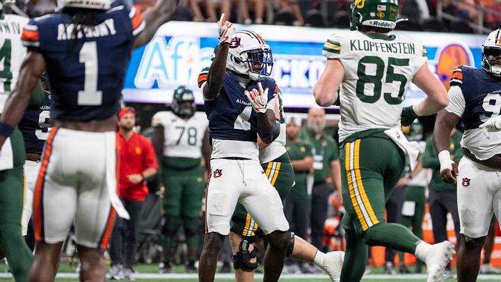 Auburn Tigers defensive back Rayshawn Pleasant (4) celebrates a stop as Auburn Tigers take on Baylor Bears in the Aflac Kickoff Game at Mercedes-Benz Stadium in Atlanta, Ga. on Saturday, Sept. 5, 2026. Auburn Tigers defeated Baylor Bears 17-16.