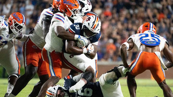 Auburn Tigers running back Bryson Washington (30) runs the ball as Auburn Tigers take on Florida Gators at Jordan-Hare Stadium in Auburn, Ala. on Saturday, Sept. 19, 2026. Florida Gators lead Auburn Tigers 20-17 at halftime.