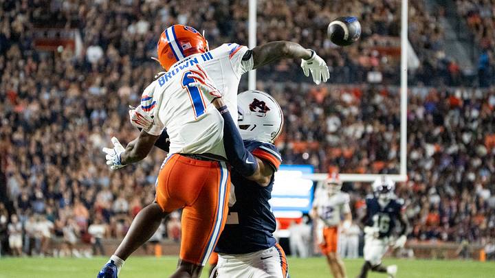 Auburn Tigers defensive back Andre Jordan Jr. (22) is called for defensive pass interference on Florida Gators wide receiver Vernell Brown III (1) as Auburn Tigers take on Florida Gators at Jordan-Hare Stadium in Auburn, Ala. on Saturday, Sept. 19, 2026. Florida Gators lead Auburn Tigers 20-17 at halftime.