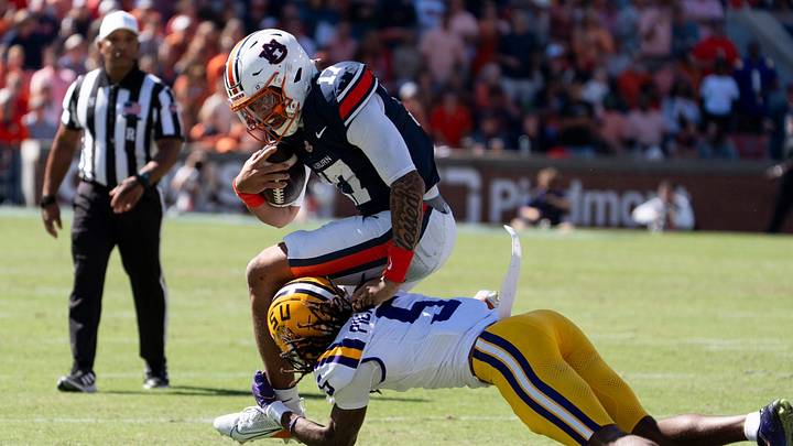 Auburn Tigers quarterback Byrum Brown (17) is tackled by LSU Tigers cornerback DJ Pickett (5) as Auburn Tigers take on LSU Tigers at Jordan-Hare Stadium in Auburn, Ala. on Saturday, Oct. 24, 2026. LSU Tigers lead Auburn Tigers 31-10 at halftime. Auburn Tigers quarterback Byrum Brown (17) is tackled by LSU Tigers cornerback DJ Pickett (5) as Auburn Tigers take on LSU Tigers at Jordan-Hare Stadium in Auburn, Ala. on Saturday, Oct. 24, 2026. LSU Tigers lead Auburn Tigers 31-10 at halftime.