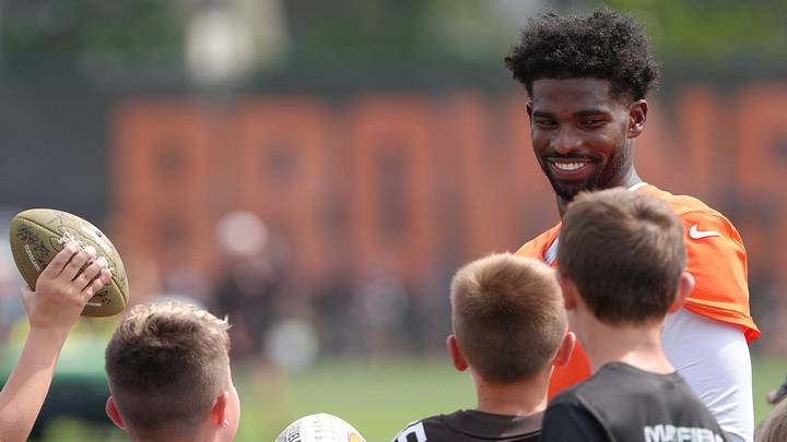 Browns quarterback Shedeur Sanders talks to young fans before signing autographs after training camp, July, 31, 2026, in Berea. Browns quarterback Shedeur Sanders talks to young fans before signing autographs after training camp, July, 31, 2026, in Berea.