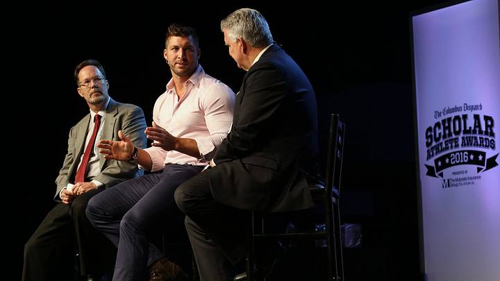 Dispatch reporter Rob Oller, Football player Tim Tebow and 10tv Reporter Dom Tiberi share a laugh during a discussion at the The Columbus Dispatch Scholar Athlete Awards Banquet featuring Tim Tebow at the Greater Columbus Convention Center in Columbus, Ohio on June 1, 2016. Dispatch reporter Rob Oller, Football player Tim Tebow and 10tv Reporter Dom Tiberi share a laugh during a discussion at the The Columbus Dispatch Scholar Athlete Awards Banquet featuring Tim Tebow at the Greater Columbus Convention Center in Columbus, Ohio on June 1, 2016.