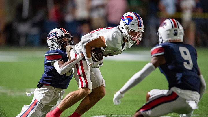 Madison-Ridgeland Academy Patriots' strong safety Ethan Davis (31) tackles Parklane Pioneers' wide receiver Davis Carruth (16) during the game at MRA in Madison, Miss., on Thursday, Aug. 15, 2024. Madison-Ridgeland Academy Patriots' strong safety Ethan Davis (31) tackles Parklane Pioneers' wide receiver Davis Carruth (16) during the game at MRA in Madison, Miss., on Thursday, Aug. 15, 2024.
